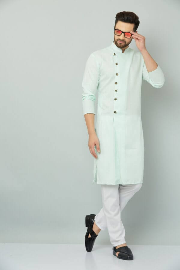 Image of a man in a mint green kurta and white pants, representing Teradozz brand's Indian style