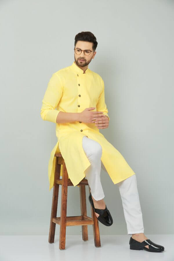 Traditional Indian yellow cotton kurta set.