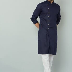 Man in navy blue Indian kurta.