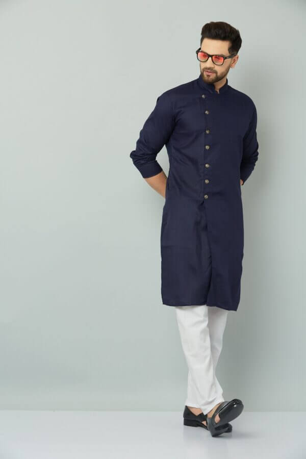 Man in navy blue Indian kurta.